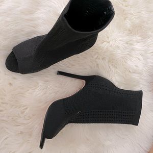 Peep toe, elastic knit, sock booties. Never worn.